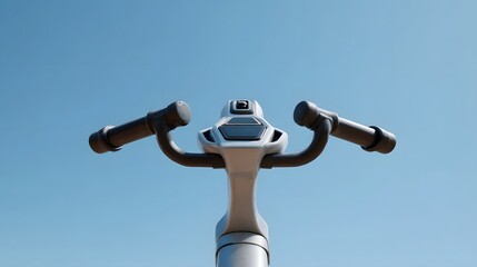 Close up of the futuristic handlebars and digital interface of a modern electric vehicle against a clear bright blue sky