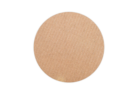 Round torn corrugated cardboard circle isolated on white background, textured kraft paper shape for crafts, labels, scrapbooking, packaging design, handmade projects