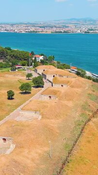 Vertical video. Kilitbahir, Turkey. Aerial drone flyover of the historic Mecidiye Bastion, a 19th-century Ottoman fortress on the Gallipoli Peninsula. Aerial View. Rich colors