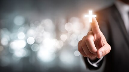 Businessman finger touches glowing white plus sign icon digitally