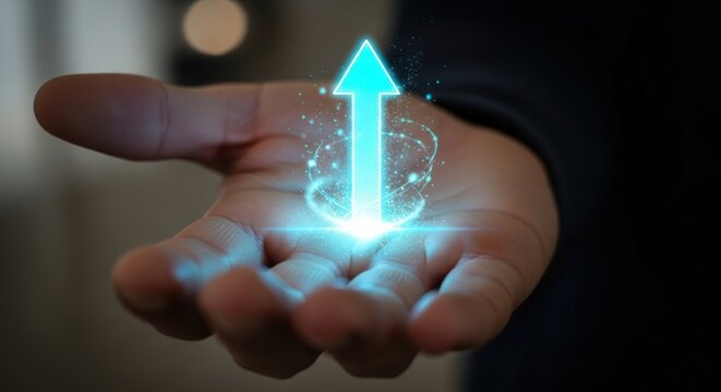 Hand holding a glowing upward arrow symbolizing growth and progress