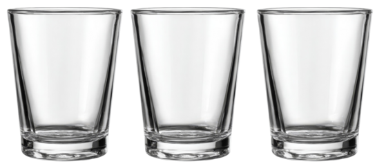 Three empty glass tumblers arranged in a row on a clean surface, showcasing their transparent design, with a soft focus background that suggests a minimalist setting