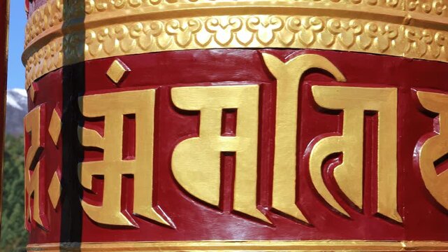 Rotating brass prayer wheels in Nepal monastery. Buddhist symbols, mantra engraving, spinning motion, cultural heritage, traditional ritual, spiritual architecture, Himalayas stock video