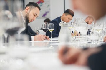 Sommelier passes training for get the certification. Wine waiter school, winemaking lecture. Blind wine tasting.