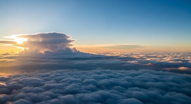 Dramatic cumulonimbus cloud formation at sunset above ocean of clouds