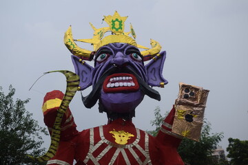 Ravnans being ignited during Dussehra festival at ramleela ground in Delhi, India, Big statue of Ravana to get fire during the Fair of Dussera to celebrate the victory of truth by Lord Rama