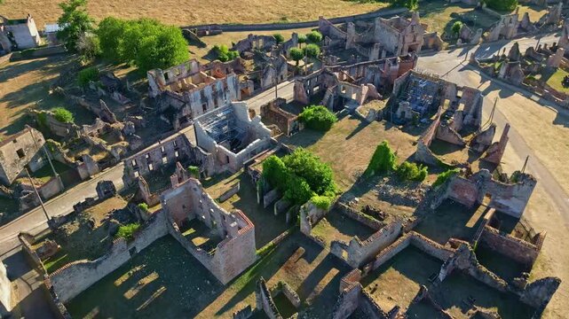 Ruins of Oradour-sur-Glane village, for historical or documentary content, France. Aerial drone backward