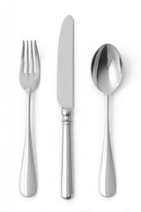 Polished silverware place setting fork, knife, spoon, arranged vertically against a bright white background, showcasing their elegant, slightly elongated designs and reflective surfaces