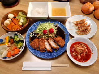 Nagoya specialty (Nagoya cuisine) - Miso cutlet set meal made with Hatcho miso (includes a small bowl of kinpira burdock, soup, and dessert) / 名古屋名物(なごやめし)～八丁味噌を使った味噌カツ定食(焼き餃子と温野菜の小鉢料理，椀物，デザート付き)