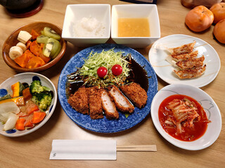Nagoya specialty (Nagoya cuisine) - Miso cutlet set meal made with Hatcho miso (includes some small bowls, soup, and dessert) / 名古屋名物(なごやめし)～八丁味噌を使った味噌カツ定食(温野菜サラダと焼きギョーザの小鉢料理，椀物，デザート付き)