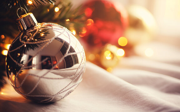 Christmas ball ornament, festive holiday decoration, shiny red bauble, cozy seasonal celebration, Christmas tree accessory, sparkling ornament for winter holidays