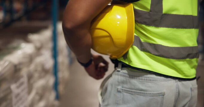 Hands, helmet and warehouse inspection with logistics, shelf and safety check with inventory management. Person, engineer and walk with ppe, hardhat and career with shipping at distribution plant - Powered by Adobe