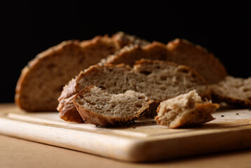 Healthy vegan dark rye sourdough bread topped with sesame and flaxseed