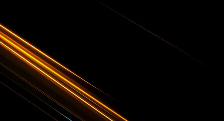 Abstract Golden Light Streaks: Sleek diagonal lines on a black background with copy space.