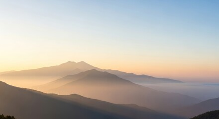 Serene Mountain Ridges Bathed in Soft Sunrise Hues Landscape Scenery