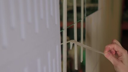 Mirror masking preparation, Detail oriented process of taping mirror for painting, Meticulous handwork involves aligning masking tape precisely on reflective glass surface