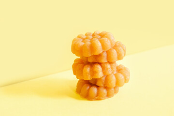 Traditional Korean honey cookies yugwa on yellow background.