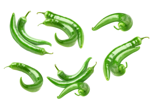 dynamic photograph capturing several glossy green chili peppers scattered and floating, highlighting their intense color, isolated object on black.