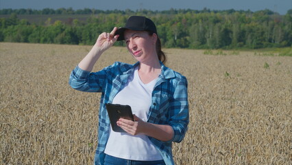 A farmer utilizing a tablet in the field for enhancing precision agriculture strategies