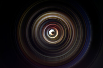 Dark abstract background with circular swirl shape.