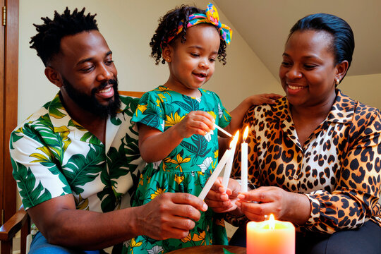 Black man, Black woman, and Black child lighting candles together, smiling and interacting closely, family members participating in shared activity, child holding candle with assistance - Powered by Adobe