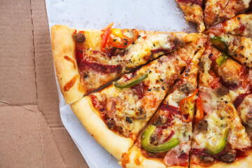 flat layout of pizza slices on cardboard packaging