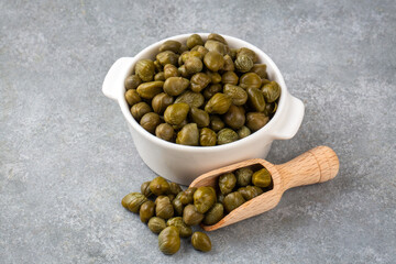 Marinated caper buds, small salted capparis in bowl, fermented food, pickled capers