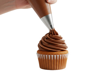 Isolated hand piping rich chocolate frosting onto a delicious vanilla cupcake creating a sweet dessert treat for celebration baking and confectionery art
