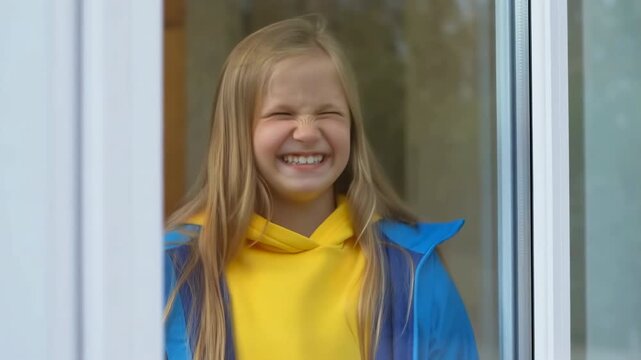 joyful playful portrait, happy white girl wearing bright clothes making funny faces outside in sunlight