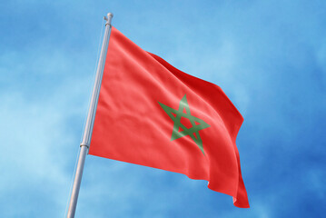 Morocco flag on sky background, waving in the wind