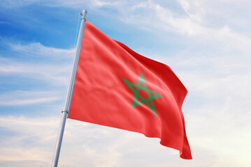 Morocco flag on blue sky background, waving in the wind