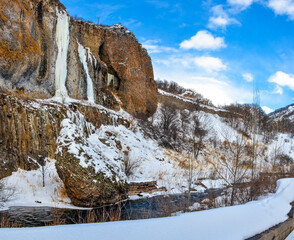 snow and frozen waterfalls on the rocks of Arpa river canyon in Jermuk (Vayots Dzor, Armenia)