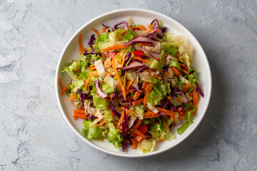 Turkish style lettuce salad. Diet salad with lettuce, red cabbage, tomatoes and carrots.
