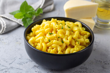 Delicious macaroni and cheese , American mac and cheese, macaroni pasta in cheesy sauce.