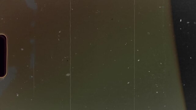 Dust and scratches with film light leaks. Analog vintage video overlay.