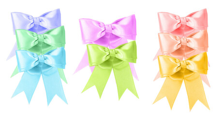 a vibrant collection photograph featuring nine satin gift bows stacked vertically in pastel shades of purple, blue, green, pink, peach, and yellow, isolated on black.