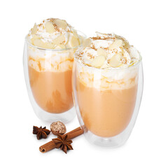 Tasty pumpkin latte with whipped cream and spices isolated on white