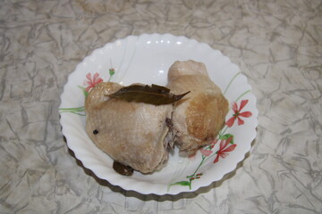 boiled chicken, two pieces per plate,