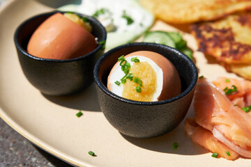 Boiled eggs with pike caviar and chopped green onions. Healthy food. Shallow depth of field