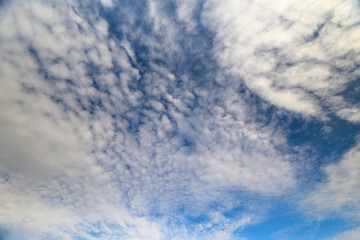 Stunning and Beautiful Cloud Patterns Floating in a Clear Bright Blue Sky Without Haze