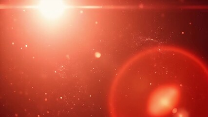 A vibrant and energetic abstract background features a brilliant light source radiating intense warmth and an elegant lens flare. Numerous shimmering, dust-like particles gracefully drift and dance ac