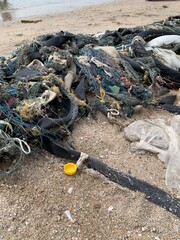 fishing process waste on sand beach background