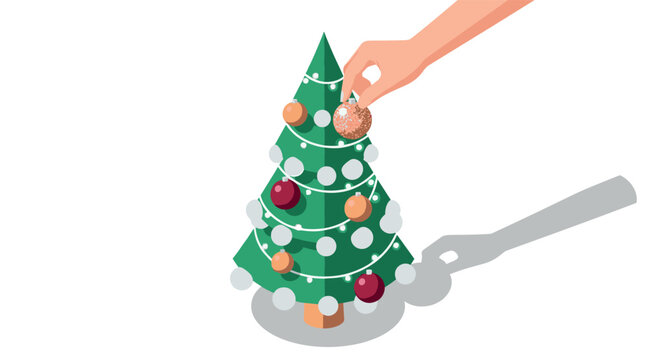 Hand decorating small christmas tree with ornaments in minimalist style