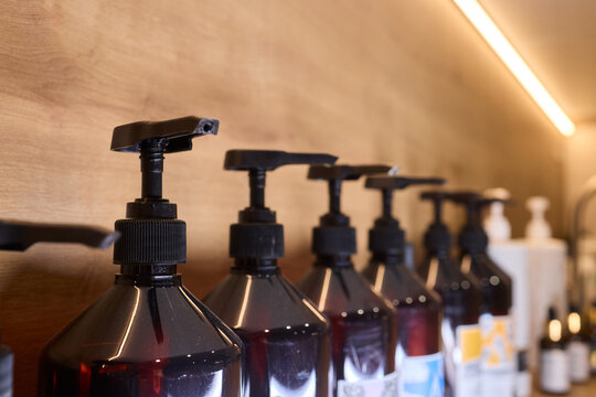 Refill station showcasing environmentally conscious container organization, Sophisticated retail or salon presentation emphasizing zero waste and natural beauty principles