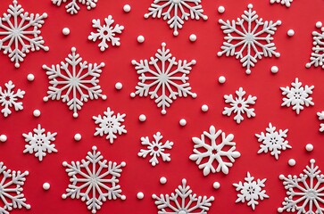 Winter holiday background with white snowflakes on red backdrop