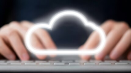 Professional working on computer actively inputting data using keyboard symbolizing cloud technology and digital information storage.