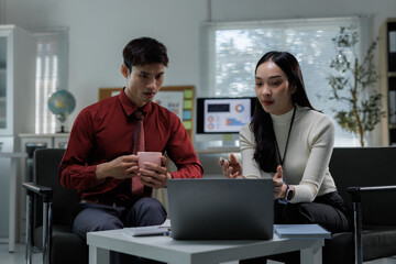 Business colleagues collaborating on project and analyzing data