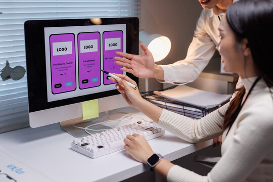Developers collaborating on mobile application uiux design