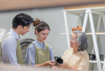 Mother and Family Business Owner Teaching About Material Production and Recycling