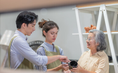 Mother and Family Business Owner Teaching About Material Production and Recycling